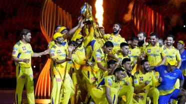Players of Chennai Super Kings celebrate with the winners trophy after their win in the Indian Premier League final cricket match against Gujarat Titans in Ahmedabad, India, Tuesday, May 30, 2023. (AP)