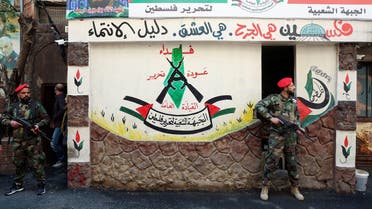 Members of the Popular Front for the Liberation of Palestine-General Command (PFLP-GC) stand guard during a parade marking the annual al-Quds Day, (Jerusalem Day), at Burj al-Barajneh Palestinian refugee camp in Beirut, Lebanon, on April 14, 2023. (Reuters)