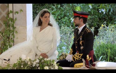 Jordan's Crown Prince Hussein and Rajwa Al Saif are seen together at their royal wedding ceremony, in Amman, Jordan, June 1, 2023 in this screen grab taken from a video. (Reuters)