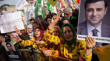 Supporters of the pro-Kurdish Peoples’ Democratic Party (HDP) hold a picture of jailed former party leader Selahattin Demirtas as they attend a ‘Peace and Justice’ rally in Istanbul on February 3, 2019. (AFP)