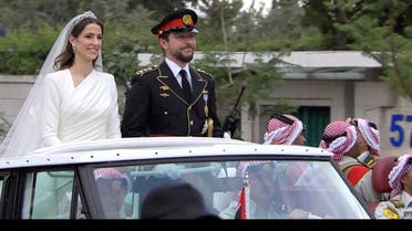The convoy carrying Jordan’s Crown Prince Hussein and Rajwa Al Saif leaves after their royal wedding ceremony in Amman, Jordan, on June 1, 2023 in this screen grab taken from a video. (Reuters)