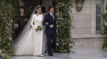 Rajwa Al Said stands with Jordan's Prince Hashem bin Abdullah, on the day of her royal wedding ceremony with Jordan's Crown Prince Hussein, in Amman, Jordan, June 1, 2023 in this screen grab taken from a video. (Reuters)