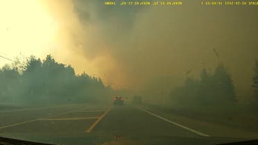 Smoke rises from a wildfire in Hammonds Plains, Nova Scotia, Canada, May 28, 2023 in this screengrab obtained from a social media video. (Reuters)