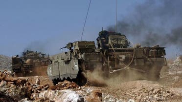 An Israeli armored vehicle on the northern Lebanese border (AFP)