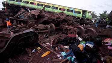Belongings of passengers lie next to a damaged coach after a deadly collision of trains, in Balasore district, in the eastern state of Odisha, India, June 3, 2023. (Reuters)