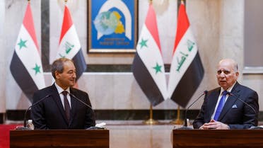 Syrian Foreign Minister Faisal Mekdad and his Iraqi counterpart Fuad Hussein attend a joint press conference, in Baghdad, Iraq June 4, 2023. (Reuters)