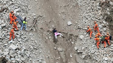 File photo of rescue workers evacuate quake-affected residents at the site of a landslide near Moxi town, following a 6.8-magnitude earthquake in Luding county, Ganzi Tibetan Autonomous Prefecture, Sichuan province, China. (Reuters)