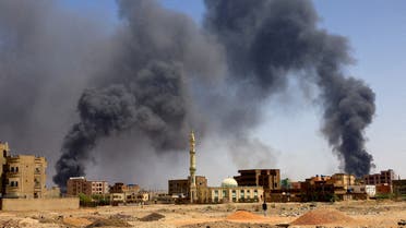 FILE PHOTO: A man walks while smoke rises above buildings after aerial bombardment, during clashes between the paramilitary Rapid Support Forces and the army in Khartoum North, Sudan, May 1, 2023. (Reuters)