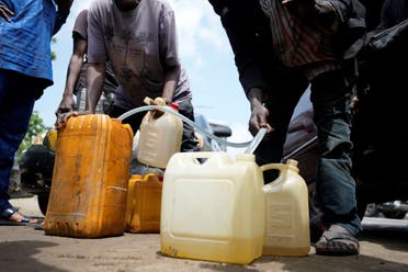 People sell fuel on the street in Lagos, Nigeria, May 30, 2023. A report released Wednesday, June 7, 2023, by the International Energy Agency says that demand for energy is growing, yet emissions are not growing as fast. (File photo: AP)