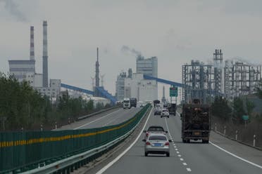 Cars move along a highway in a coal producing region in Yulin in northwestern China's Shaanxi province, April 24, 2023. A report released Wednesday, June 7, 2023, by the International Energy Agency says that demand for energy is growing, yet emissions are not growing as fast. (File photo: AP)