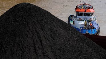 A tug boat pushes a barge carrying coal on Mahakam river in Samarinda, East Kalimantan, Indonesia, Dec. 19, 2022. A report released Wednesday, June 7, 2023, by the International Energy Agency says that demand for energy is growing, yet emissions are not growing as fast. (File photo: AP)