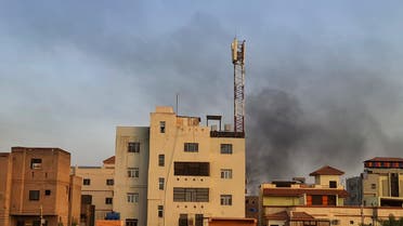 Smoke billows behind buildings amid ongoing fighting in Khartoum on June 6, 2023. Battles raged in Sudan's war-torn capital on June 6, witnesses said, and the residents of an island in the Nile reported being under siege amid desperate shortages. (Photo by AFP)