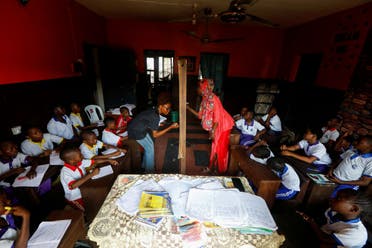 Students attend classes at My Dream Stead, a low-cost school that accepts recyclable waste as payment, in Ajegunle, Lagos, Nigeria May 19, 2023. (REUTERS)