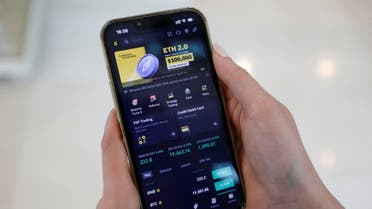 Asal Alizade, an Iranian trader on Binance, a cryptocurrency exchange platform, displays the mobile application on her smart phone in Dubai, United Arab Emirates, July 4, 2022. (File photo: Reuters)