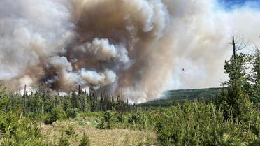 This handout image provided by the BC Wildfire Service on June 7, 2023, shows smoke from the West Kiskatinaw River and Peavine Creek wildfires in the Dawson Creek Zone, British Colombia, Canada. (AFP)
