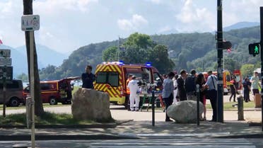 Medics and emergency personnel work at the site where a person wounded four children and an adult in a knife attack in a park in Annecy, France June 8, 2023. (Reuters)