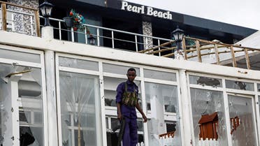 A Somali police officer looks from the Pearl Beach Restaurant following an attack by Al Shabaab militants at the Liido beach in Mogadishu, Somalia June 10, 2023. (Reuters)