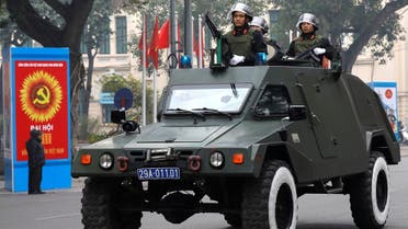 Riot police officers patrol on an armoured vehicle on a street in Hanoi, Vietnam. (Reuters)