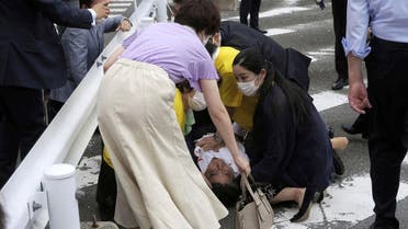 Former Japanese prime minister Shinzo Abe lies on the ground after apparent shooting during an election campaign for the July 10, 2022, Upper House election, in Nara, western Japan, July 8, 2022. (File photo: Kyodao/Reuters)