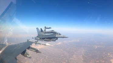 F-16 fighter jets accompany the F-22 Raptors heading to the Middle East. (US Central Command)