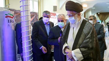 A handout picture made available by the office of Iran’s Supreme Leader Ali Khamenei shows him (front) visiting an exhibition of the country’s nuclear industry achievements in Tehran, on June 11, 2023, accompanied by the head of the Atomic Energy Organization of Iran Mohammad Eslami (L). (Khamenei.ir via AFP)