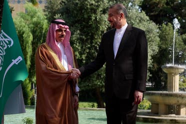 Iranian Foreign Minister Hossein Amir-Abdollahian, right, and his Saudi counterpart Prince Faisal bin Farhan shake hands prior to their meeting in Tehran, Iran, Saturday, June 17, 2023. (AP)