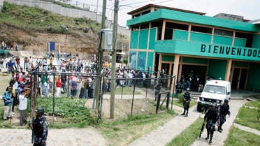 Prisoners gather after a riot inside the prison in Tegucigalpa May 3, 2008. (Reuters)
