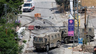 Israeli military vehicles drive during an Israeli raid in Jenin, in the Israeli-occupied West Bank June 19, 2023.  (Reuters)