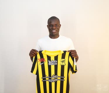 N'Golo Kante holds his Al-Ittihad team jersey. (Twitter)