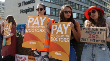 Demonstrators protest at a picket line outside of St Thomas’ Hospital as junior doctors strike over pay and conditions, in London, Britain, on June 14, 2023. (Reuters)