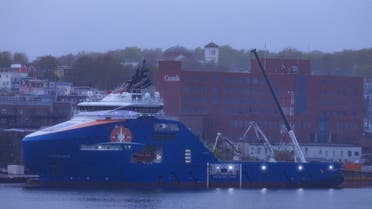 Equipment supplied via a US Airforce airlift is loaded onto the Horizon Arctic as it prepares to depart in support of the search for the missing OceanGate Expeditions submersible, which is carrying five people to explore the wreck of the sunken Titanic, in the port of St. John’s, Newfoundland, Canada June 20, 2023. (Reuters)