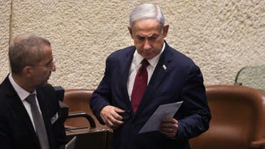 Israeli Prime Minister Benjamin Netanyahu votes at the parliament, the Knesset, in Jerusalem on June 14, 2023. (AFP)