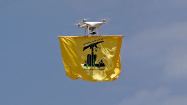 A drone carries a flag of Lebanon’s Hezbollah movement above Aaramta bordering Israel on May 21, 2023 ahead of the anniversary of Israel’s withdrawal from southern Lebanon in 2000. (AFP)