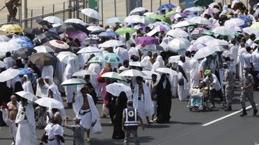 Pilgrims walk on a road in Mina, near the holy city of Mecca September 24, 2015. (Reuters)