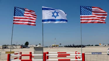 The American and Israeli flags at Ben Gurion Airport near Tel Aviv on July 12, 2022 (Reuters)