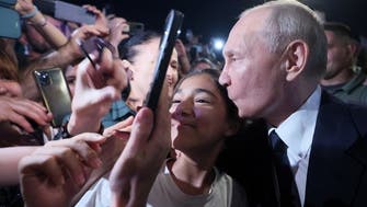 Putin seen greeting crowd, with Kremlin insisting he has ‘astounding’ support 