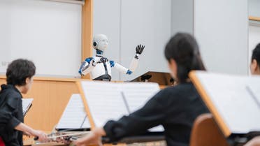 This handout picture taken on June 26, 2023 and provided by the National Theater of Korea shows the South Korean-made robot called EveR 6 conducting musicians of the National Orchestra of Korea during a practice session at the national theatre in Seoul. (AFP)