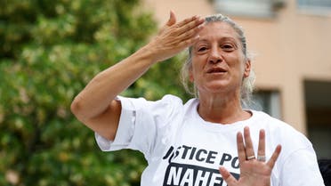 Mounia, the mother of Nahel, a 17-year-old teenager killed by a French police officer in Nanterre during a traffic stop, blows a kiss to the crowd as she attends a march in tribute to her son in Nanterre, Paris suburb, France, June 29, 2023. (Reuters)