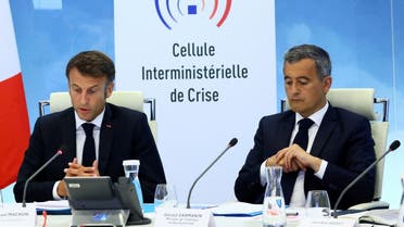 French President Emmanuel Macron and Interior and Overseas Minister Gerald Darmanin attend a government emergency meeting after riots erupted for the third night in a row across the country following the death of Nahel, a 17-year-old teenager killed during a traffic stop in Nanterre by a French police officer, at the emergency crisis center of the interior ministry in Paris, France, on June 30, 2023. (Reuters)