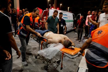 A person is transported on a stretcher after a Palestinian was killed during an Israeli military operation, in Jenin, in the Israeli-occupied West Bank July 3, 2023. (Reuters)