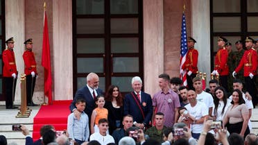 Former U.S. president Bill Clinton and Albanian Prime Minister Edi Rama pose for a picture, in front of the Prime Minister office in Tirana, Albania, July 3, 2023. (Reuters)