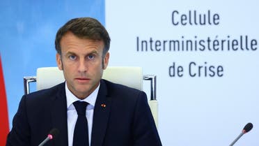 French President Emmanuel Macron addresses a meeting after riots erupted across the country following the death of Nahel, a 17-year-old teenager killed during a traffic stop in Nanterre by a French police officer, at the emergency crisis center of the Interior Ministry in Paris, France, June 30, 2023. (AFP)