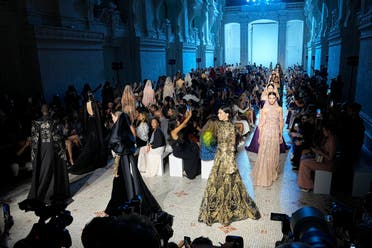 Models wear creations for the Elie Saab Haute Couture Fall/winter 2023-2024 fashion collection presented in Paris, Wednesday, July 5, 2023. (AP Photo/Michel Euler)