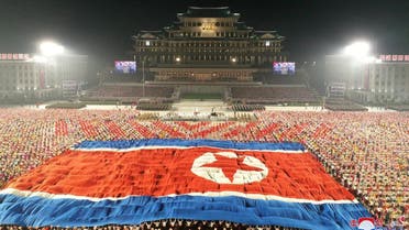A giant North Korean flag is seen during a paramilitary parade held to mark the 73rd founding anniversary of the republic at Kim Il Sung square in Pyongyang in this undated image supplied by North Korea’s Korean Central News Agency on September 9, 2021. (Reuters)