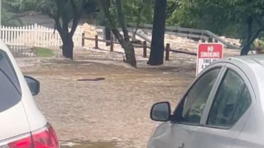 Streets are flooded in Highland Falls, Orange County, U.S., in this video screengrab obtained from social media, July 9, 2023. (Reuters)