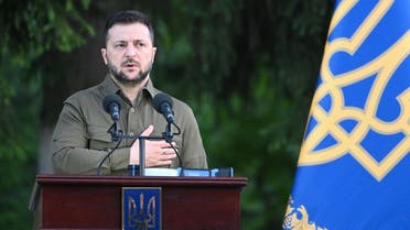 Ukraine’s President Volodymyr Zelenskyy sings Ukraine’s national anthem during an event for the return of commanders of Ukrainian forces who held Mariupol’s resistance in the city’s Azovstal steel plant, in the western Ukrainian city of Lviv on July 8, 2023. (AFP)
