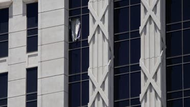 A curtain hangs out of a broken window on a hotel tower at Caesars Palace Hotel & Casino, Tuesday, July 11, 2023, in Las Vegas. (AP)