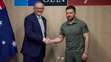 Ukraine’s President Volodymyr Zelenskyy and Australia’s Prime Minister Anthony Albanese shake hands before a meeting at the NATO Summit in Vilnius, Lithuania, on July 12, 2023. (Reuters)