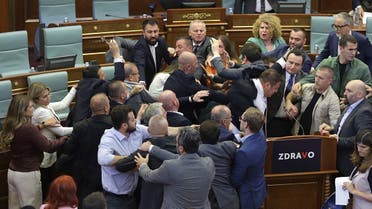 Kosovo opposition lawmakers clash with ruling members in the Kosovo parliament on July 13, 2023 during a heated debate over measures aimed at defusing tensions in restive Serb enclaves in the north. (AFP)