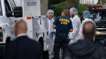 Crime laboratory officers arrive to the house where a suspect has been taken into custody on New York's Long Island in connection with a long-unsolved string of killings, Friday, July 14, 2023, in Massapequa, New York. (AP Photo/Eduardo Munoz Alvarez)